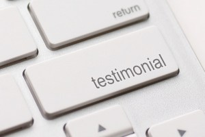 Photo of a keyboard with a Testimonial button